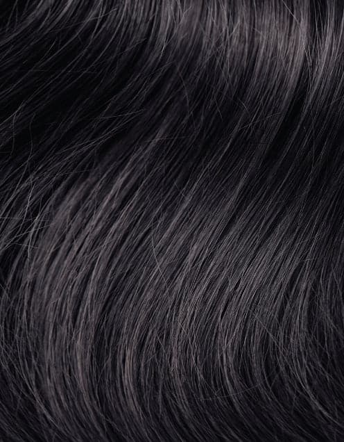A detailed view of a sleek black HairTalk Extension, showcasing its texture and shine.